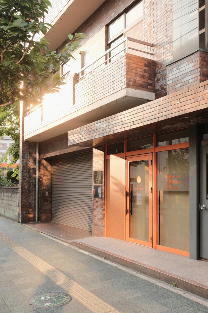A building exterior is bathed in warm sunlight.